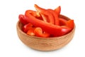 slices of red sweet bell pepper in wooden bowl isolated on white background with full depth of field Royalty Free Stock Photo