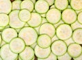 Slices ripe fruits of zucchini texture, background