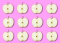 Slices of ripe green Apple on a pink background. Pattern Wallpaper Flat lay top view Royalty Free Stock Photo