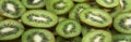 Slices of ripe kiwi. Background and texture. Panorama. Royalty Free Stock Photo