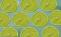 Slices of ripe lemon on a light blue background