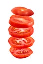 Slices red tomato flying in the air isolated on white background. Food levitation concept