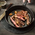 Slices roast beef steak vintage cast iron frying pan