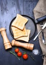Slices of roast bread with tomatoes, thyme, fork and knife. Royalty Free Stock Photo