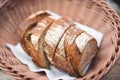 Slices rolls of white ,sourdough rye whole wheat brown dark cereal natural bread handmade at bakery with flour barley in wicker ba Royalty Free Stock Photo