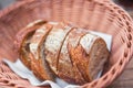 Slices rolls of white ,sourdough rye whole wheat brown dark cereal natural bread handmade at bakery with flour barley in wicker ba Royalty Free Stock Photo