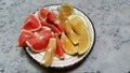 Overhead Photograph of Ruby Red and Golden Yellow Grapefruit Slices Royalty Free Stock Photo