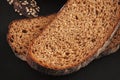 Slices of rye bread on black background Royalty Free Stock Photo