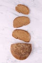 Slices of Rye Bread on the table, top view, vertical Royalty Free Stock Photo