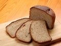 Slices of rye bread on a wooden board Royalty Free Stock Photo