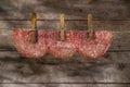 Slices of salami hanging