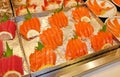 Slices salmon sashimi on tray