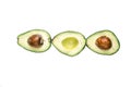 Slices of with seed of avocatto a white background