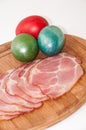 Slices of smoked ham with easter egg Royalty Free Stock Photo