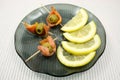 Slices of a smoked humpback salmon with olives and a lemon Royalty Free Stock Photo