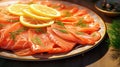 Slices of smoked salmon on a plate with dill and lemon.