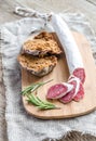 Slices of spanish salami on the sackcloth Royalty Free Stock Photo