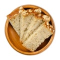 Slice of brown sourdough spelt bread in a wooden bowl Royalty Free Stock Photo