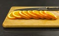 Slices of sweet orange on a chopping board.