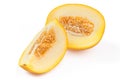 Slices sweet yellow melon with seeds. Close-up on white background