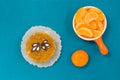 Slices of tangerine. Cake. Blue background. Top View