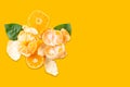 Slices of tangerine or orange. Fruit background. Flat lay, isolated on color background. Food background. Top view Royalty Free Stock Photo