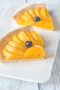 Slices of tart with peaches and blueberry Royalty Free Stock Photo