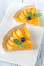 Slices of tart with peaches and blueberry Royalty Free Stock Photo