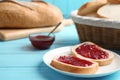 Slices of tasty fresh bread with jam on  blue wooden table Royalty Free Stock Photo