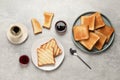 Slices of tasty toasted bread, jam and aromatic coffee on light grey table, flat lay Royalty Free Stock Photo