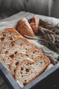 Slices of tasty whole wheat bread on a wooden table. Close-up Royalty Free Stock Photo