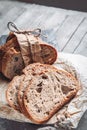 Slices of tasty whole wheat bread on a wooden table. Close-up Royalty Free Stock Photo