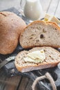 Slices of tasty whole wheat bread on a wooden table. Close-up Royalty Free Stock Photo