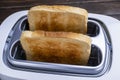 Slices of toast coming out of the toaster for healthy breakfast Royalty Free Stock Photo