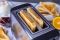 Slices of toast coming out of the toaster for healthy breakfast Royalty Free Stock Photo