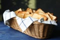 Slices of toasted bread in basket on wooden table Royalty Free Stock Photo