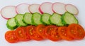 Slices of tomatoes, cucumbers and redish