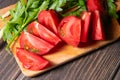 Slices tomatoes served with greenery