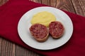 Slices of traditional Italian sausage Zampone di Modena with mashed potatoes Royalty Free Stock Photo