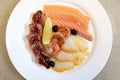 Slices various salted fish on plate