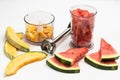 Slices of watermelon and melon. Pieces of melon and watermelon in blender jar. Metal blender Royalty Free Stock Photo