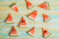Slices of watermelon on old blue and yellow wooden background. Chopped watermelon. summer, harvest and vacation concept. Flat lay Royalty Free Stock Photo