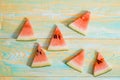 Slices of watermelon on old blue and yellow wooden background. Chopped watermelon. summer, harvest and vacation concept Royalty Free Stock Photo