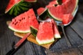 Slices of watermelon on old wooden rustic table Royalty Free Stock Photo