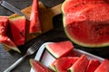 Slices of watermelon on old wooden rustic table Royalty Free Stock Photo