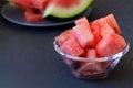 Watermelon in a glass bowl on the black background