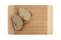 Slices wheat bread on wooden board, top view