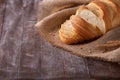 Slices of white bread on burlap on the dark wooden table, Space for text Royalty Free Stock Photo