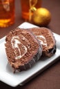 Slices of Yule log cake on a Christmas table Royalty Free Stock Photo