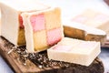 Slicing Battenberg homemade sponge cake Royalty Free Stock Photo